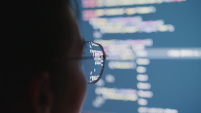 Software Engineer writing code on computer