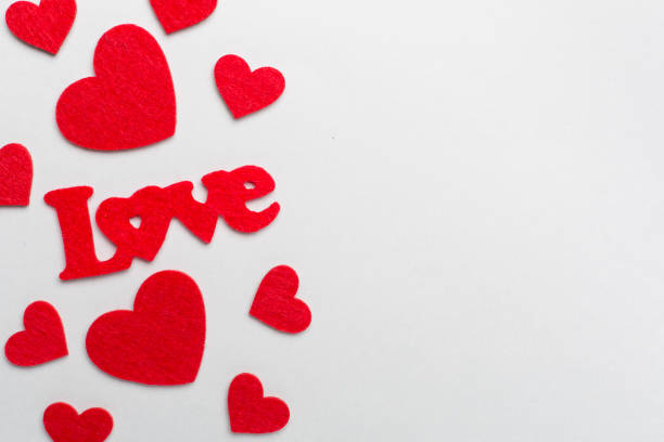 istock Felt word love with hearts on color background, top view 1699104071