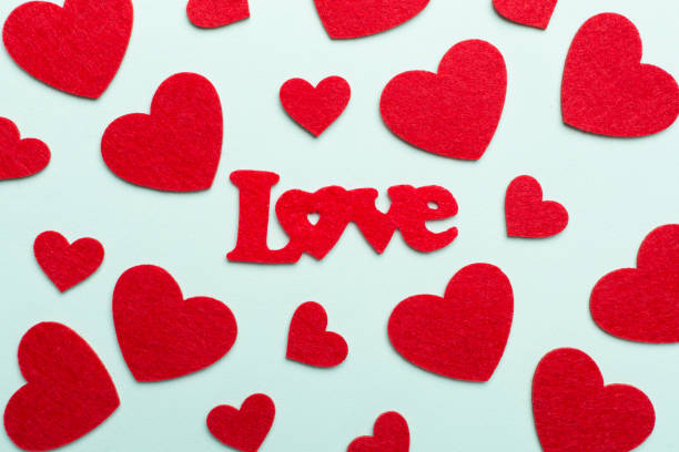 istock Felt word love with hearts on color background, top view 1699104073