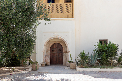 The traditional blue doors in Tunisia. This charming town Hara Sghira Er Riadh is known for its distinctive white buildings with blue accents, including doors and window frames.