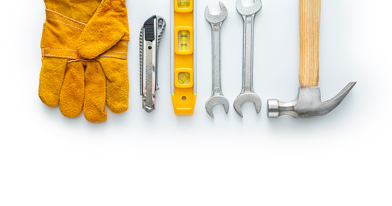 Leather Work Glove and tools, isolated on white background