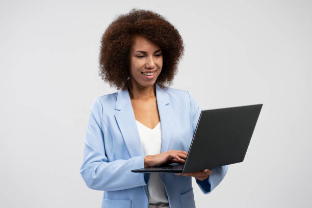 istock African American business woman using laptop computer isolated on background 1699144264