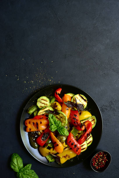 istock Grilled colorful vegetable : bell pepper, zucchini, eggplant on a plate . Top view with copy space. 1699148661
