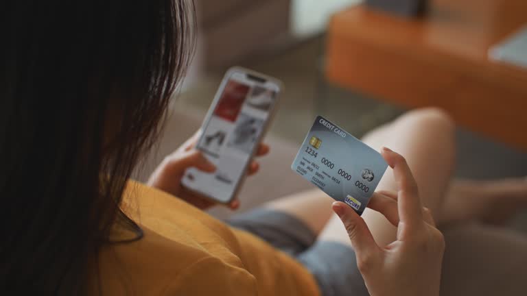 Woman do Online Shopping on sofa at home