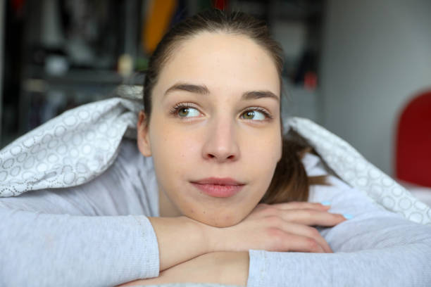 Beautiful young girl in bed