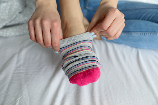 Women's beautiful socks on bed