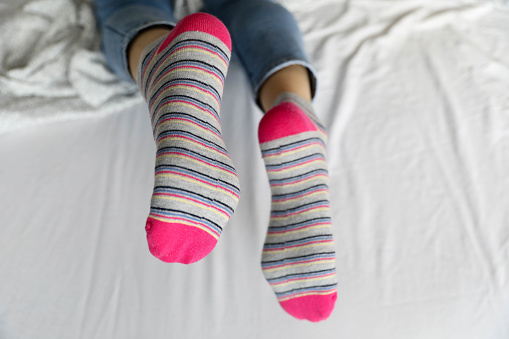 Women's beautiful socks on bed