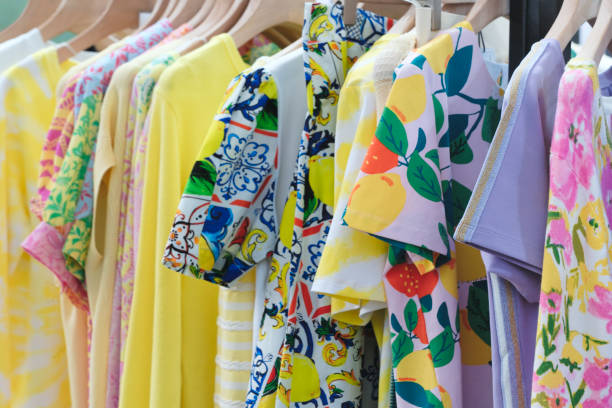 istock Multicolor family clothes on hangers in store 1699176837