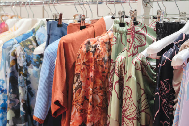 istock Multicolor family clothes on hangers in store 1699221628