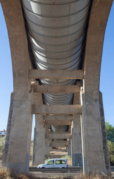 istock Vehicule crossing under Acedera Aqueduct, Spain 1699241118