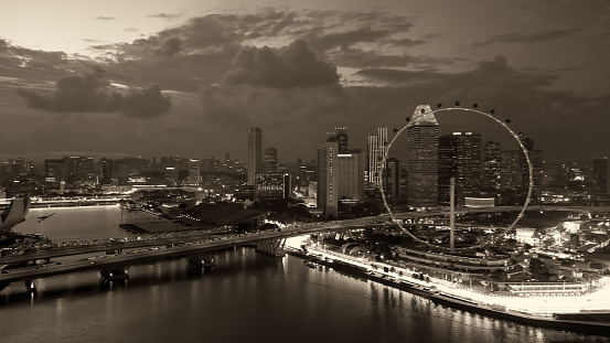 Sunset aerial view of Marina Bay and Singapore skyline.
