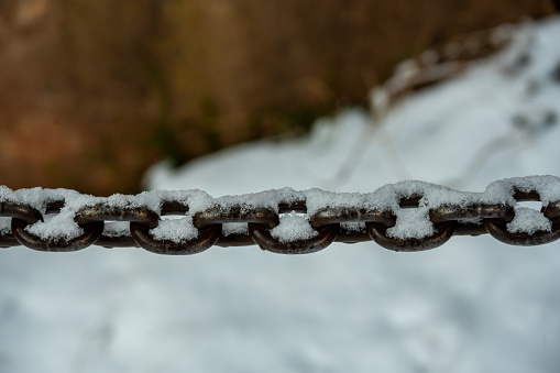 Links of Chain Covered In Snow along trail in the Grand Canyon
