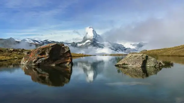 The Stellisee lake with a relection of Matterhorn during a lovely morning hike in Zermatt, Switzerland