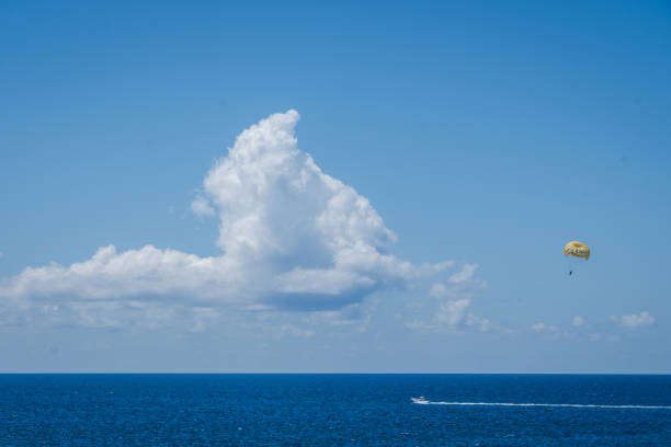 Fun in the tropical paradise on a right sunny day in the turquoise-blue colored sea