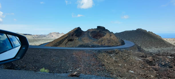 istock Volcanic Crater and Surrounding Road, Lanzarote, Spain 1699284664