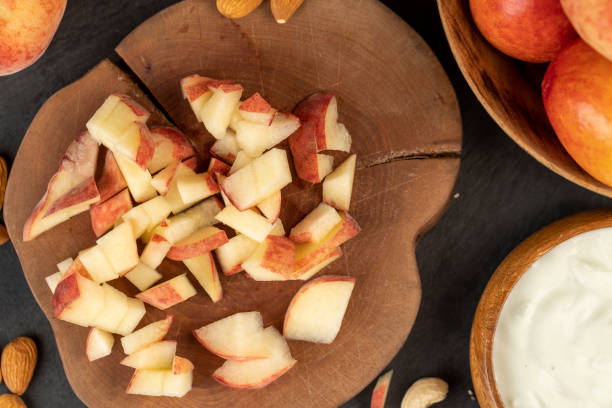 istock ripe delicious peaches on the table, making desserts 1699296456