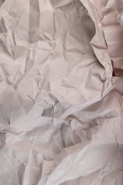 istock gray low-quality crumpled paper from recycled waste paper 1699297080