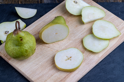 sliced ripe and juicy green pears, delicious pears washed and ready for cooking