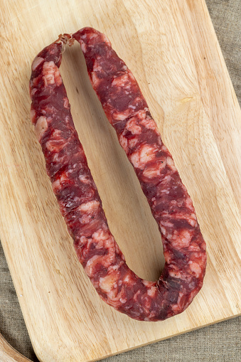 natural pork meat with spices from which sausage was made, homemade cured sausage with pork