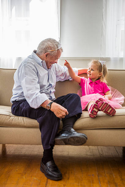 istock Grandpa and grandaughter playing princess 169937490