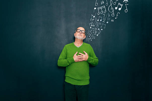 Music and emotions Senior man enjoying music. musical note photos stock pictures, royalty-free photos & images