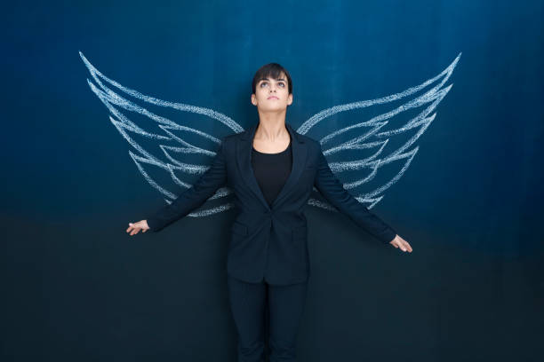 Businesswoman day dreaming stock photo