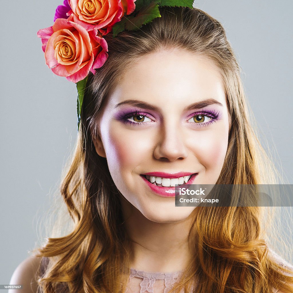 Beautiful young woman with roses in her hair 20-24 Years Stock Photo