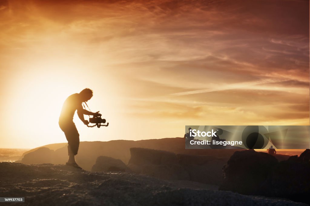 Kameramann bei Sonnenuntergang - Lizenzfrei Filmen Stock-Foto