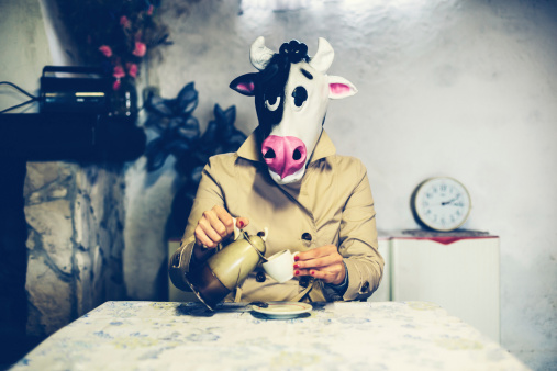 Woman wearing a cow mask