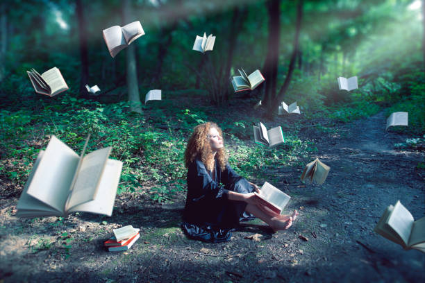 The magic forest Mystic forest with floating books. illusion photos stock pictures, royalty-free photos & images