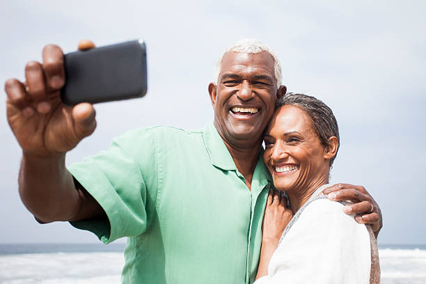 istock African American Seniors Smiling Together on Beach 169938720