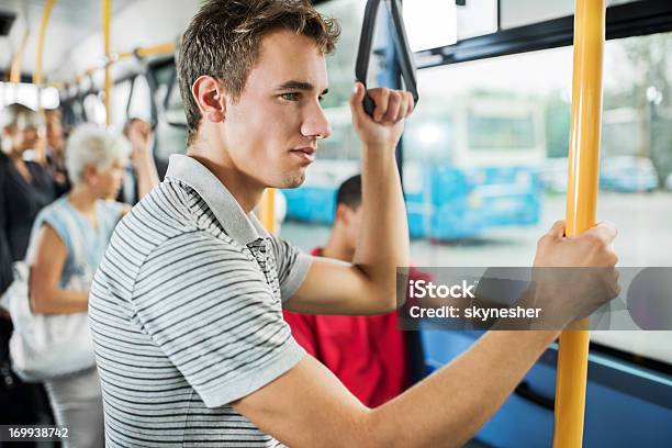 Młody Człowiek Dojeżdżając Autobusem - zdjęcia stockowe i więcej obrazów Adolescencja - Adolescencja, Autobus, Autokar