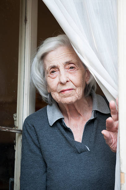 istock Senior Woman Staying on the door 169939949
