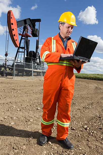 istock Oil Worker and Laptop 169940006