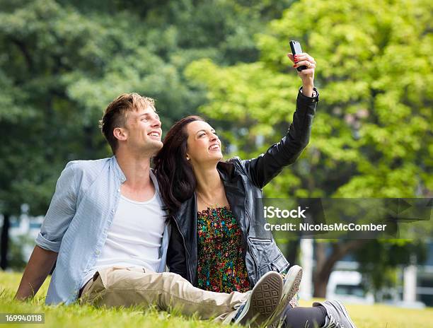 Making Romantic Memories With Smart Phone Stock Photo - Download Image Now - City, Public Park, 20-29 Years