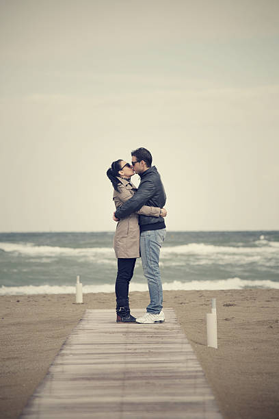istock Couple loving on the beach 169940390