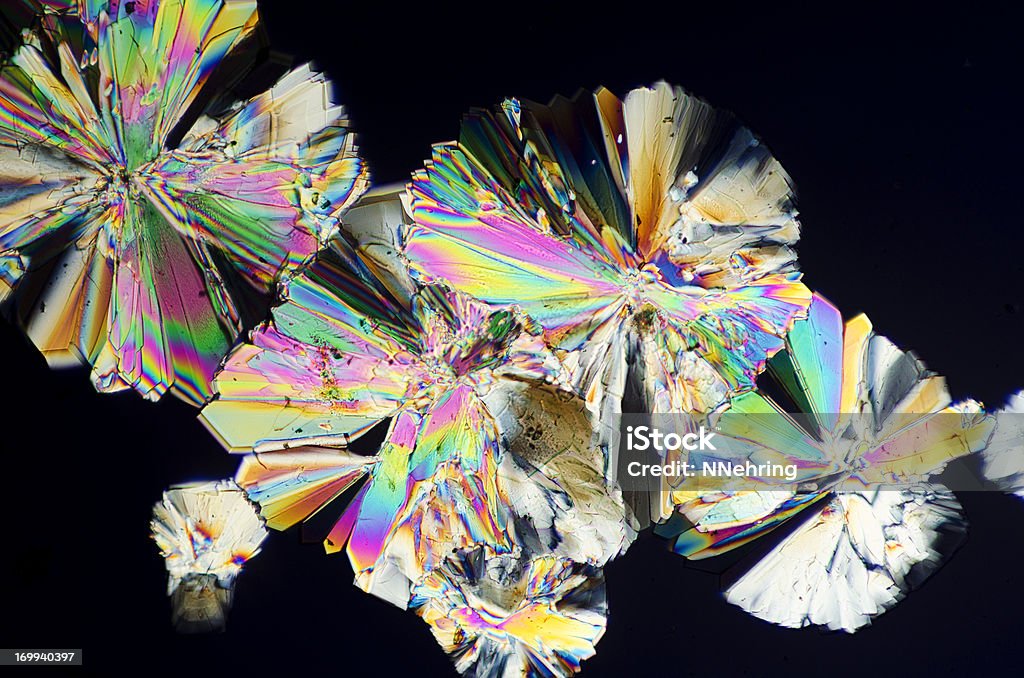 sugar crystals micrograph in abstract pattern Photomicrograph of dextrose sugar crystals. Dry mount, 5X objective, polarized illumination. Crystal Stock Photo