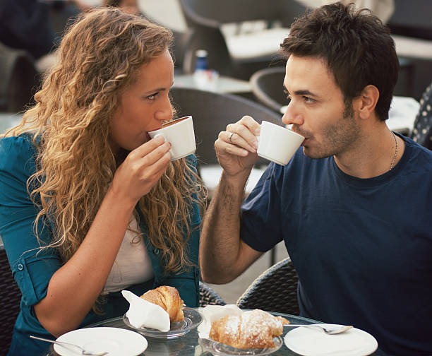 istock Loving Couple Having a Breakfast at Cafe. 169940726