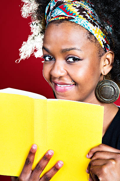 istock Happy woman with book 169940811