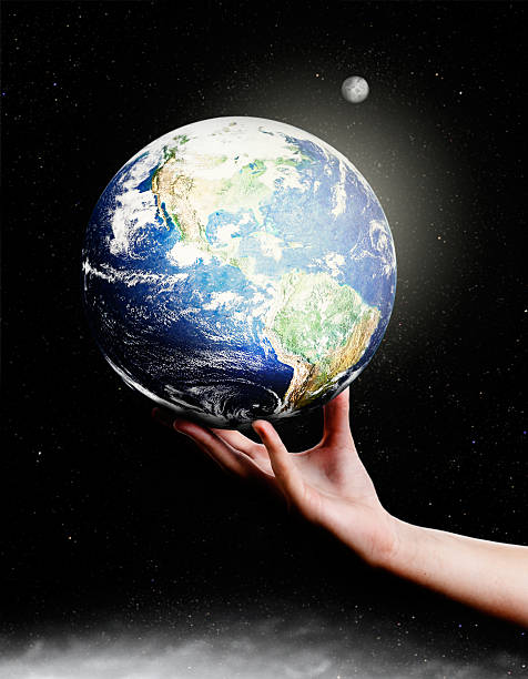 istock Female hand supports Earth against starfield 169940857
