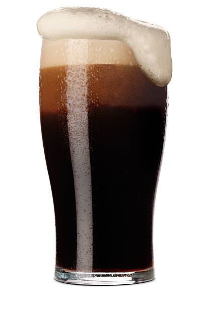 Pint of Stout Freshly pulled pint of Stout with its frothy head in a traditional pint glass. Isolated on white with a small shadow bitter stock pictures, royalty-free photos & images