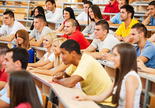 istock Large group of students at university amphitheatre. 169941222