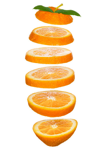 freschi fette di arancia saltati in aria - orange slices foto e immagini stock