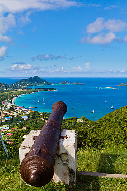 From the hill of Belair, the site of the Carriacou hospital, you can have a breathtaking view of the town of Hillsborough and its beautiful bay. Visible is also the small Sandy Island with its white sandy beach. Some old rusty cannons are pointed on the bay. Carriacou, Grenada W.I.