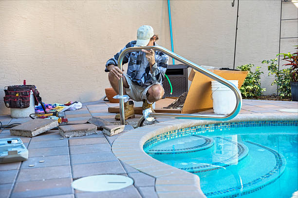 Safety: Installing a pool Hand rail stock photo