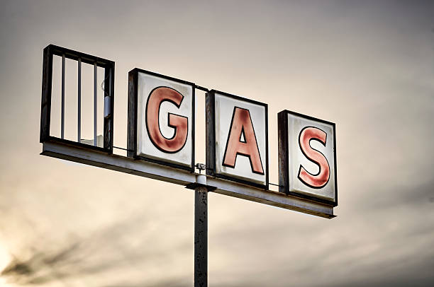Classic Americana Route 66 Abandoned Gas Station Neon Sign An abandoned gas station neon sign vintage gas pumps stock pictures, royalty-free photos & images