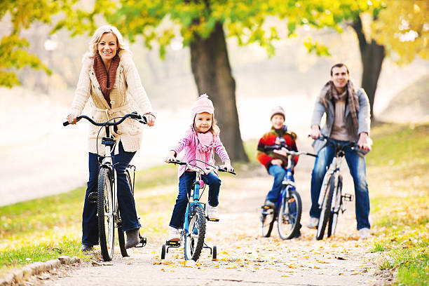 istock Happy family riding bicycles in nature. 169941788