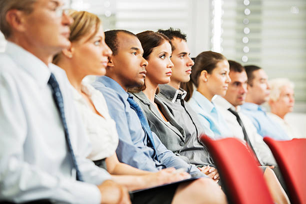 istock Group of businesspeople sitting in a line. 169941820