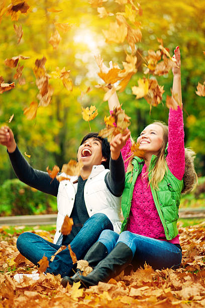 istock Happy young couple in autumn park 169942104