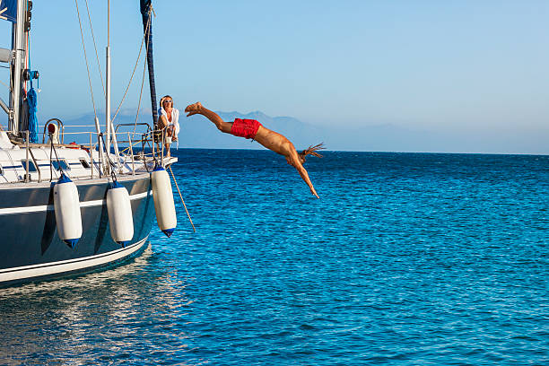 istock Jumping in the sea 169942125
